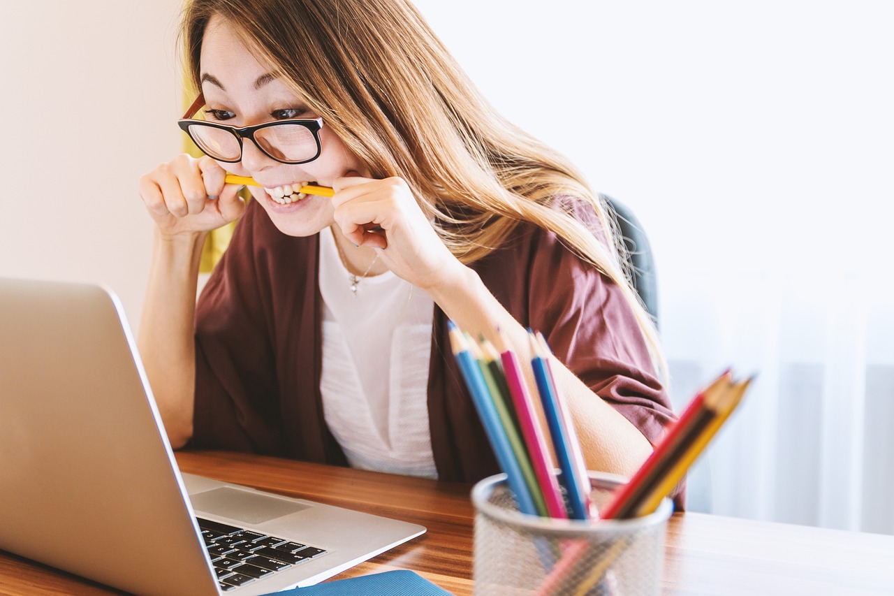Student focused at laptop